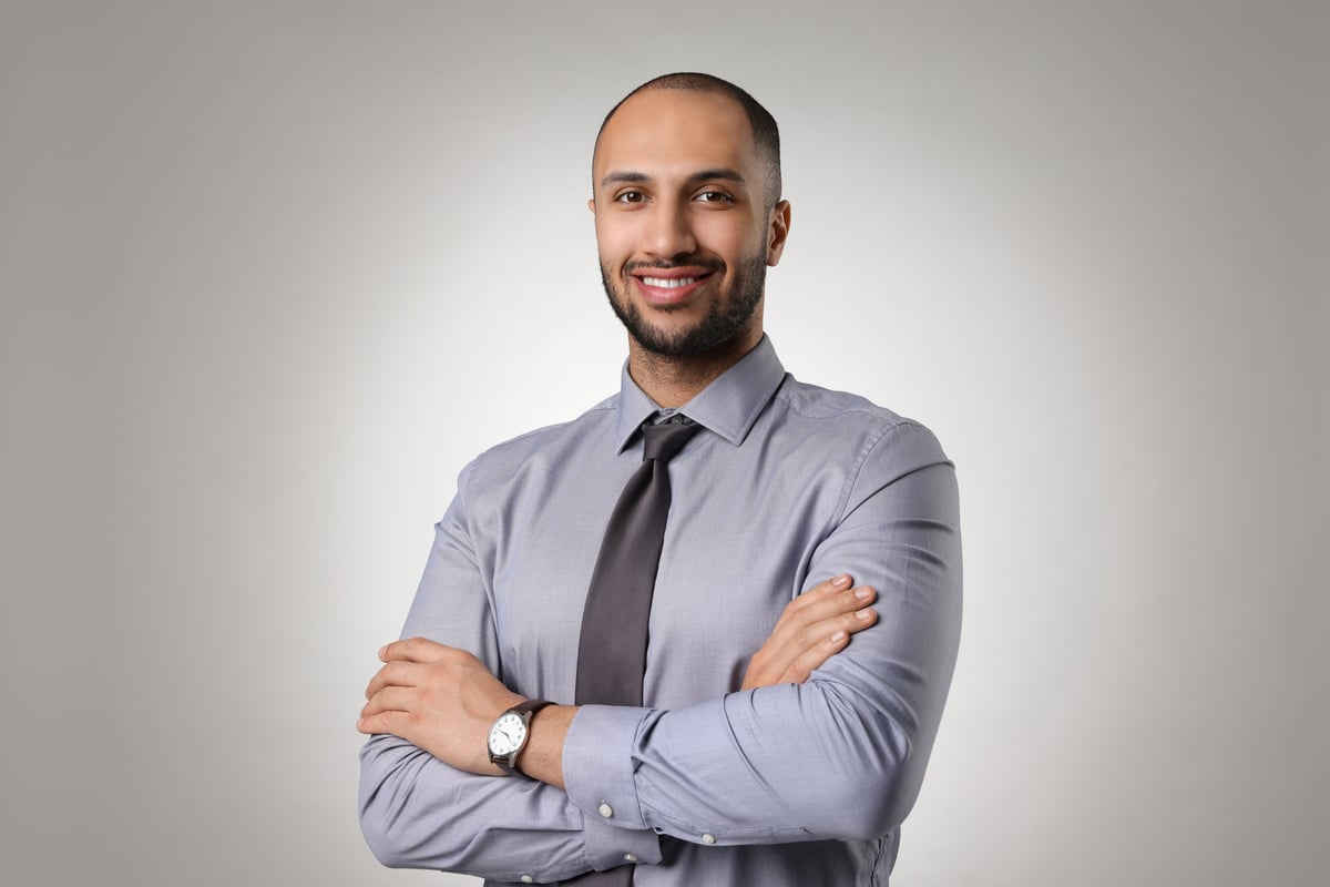 Portrait of businessman on light gray background